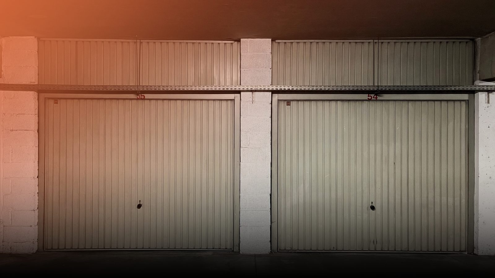 A row of closed residential garage doors