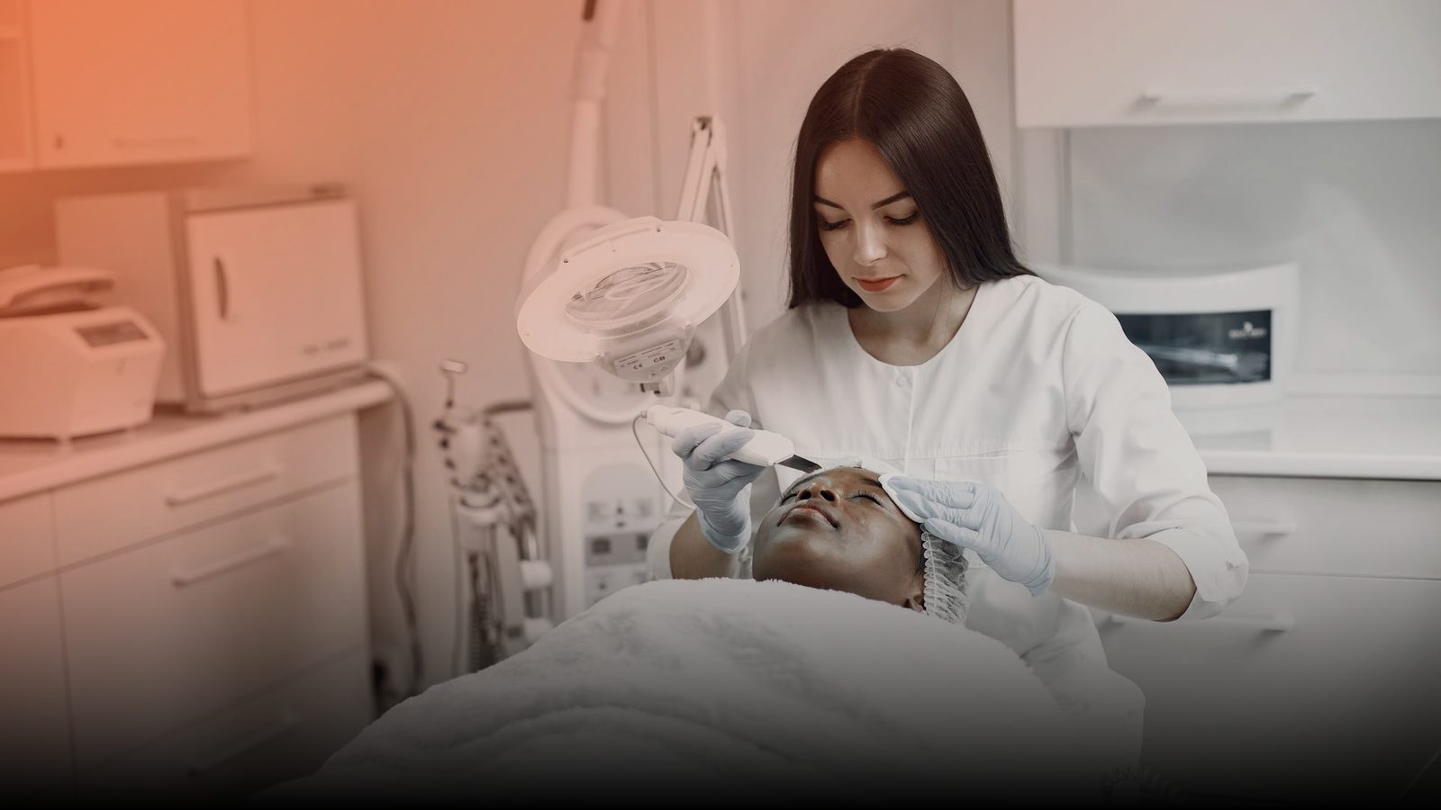 An esthetician performing a skin treatment on a client