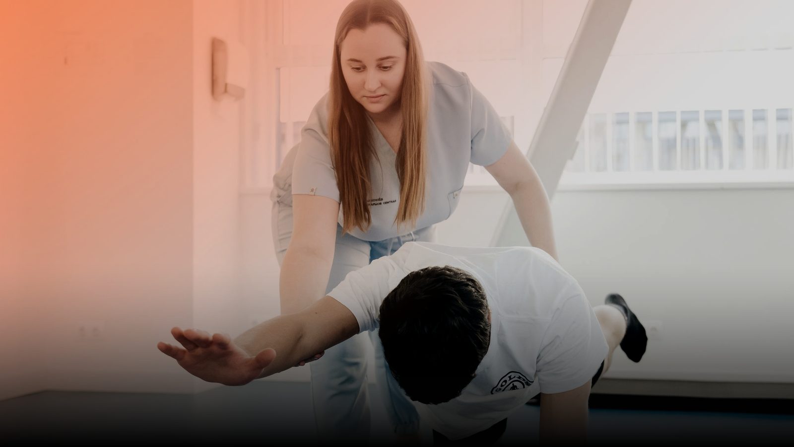 A physical therapist guiding a patient through an exercise
